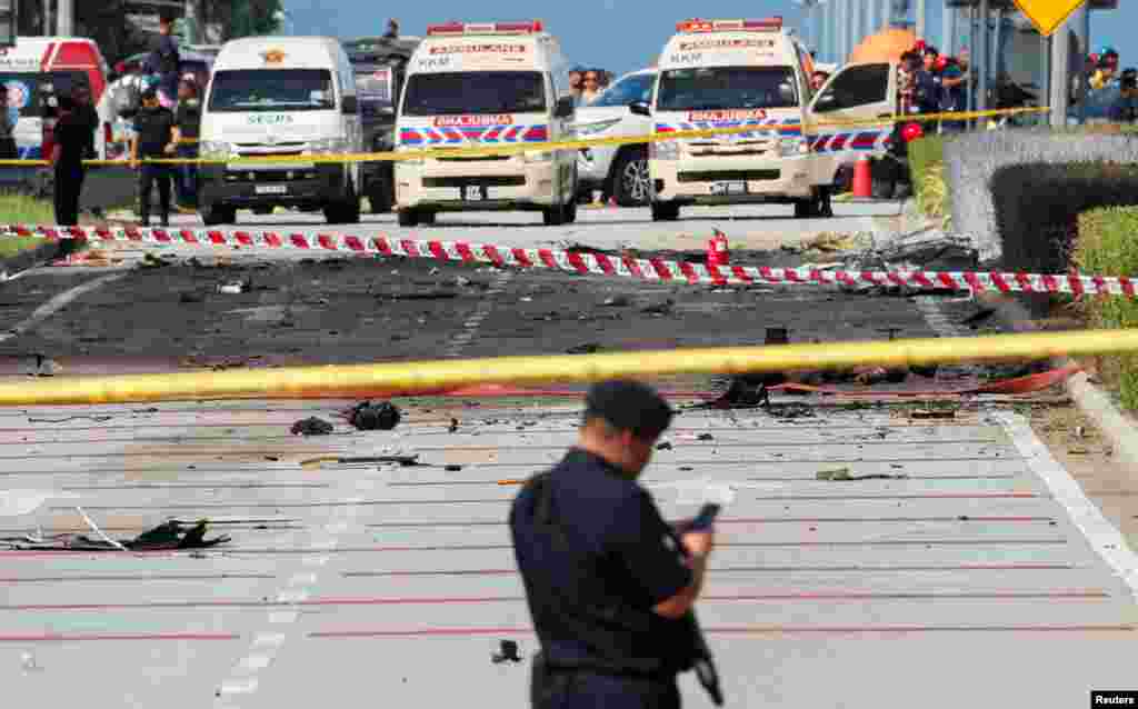 This image shows the site of a plane crash in Shah Alam, Malaysia.&nbsp;A small private jet crashed into a motorbike and a car while attempting to land at an airport in the outskirts of the capital Kuala Lumpur, leaving at least 10 people dead, officials said.