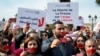 FILE - Journalists in Tunis, Tunisia, protest the threat of danger the press faces and the return to the country's dictatorship, especially after the arrest of the general manager of Radio Mosaique Noureddine Boutar, Feb. 16, 2023.