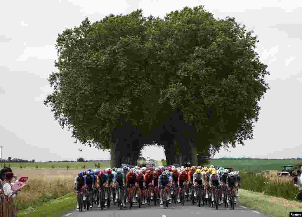 The pack of riders cycle in Orleans during the tenth stage of the Tour de France cycling race between Orleans and Saint-Amand-Montrond, central France.