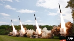 22일 북한 비공개 장소에서 진행된 핵반격가상종합전술훈련 중 방사포가 발사되는 모습. 북한 관영매체 조선중앙통신이 23일 보도.