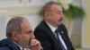 FILE - Armenia's Prime Minister Nikol Pashinyan and Azerbaijan's President Ilham Aliyev attend a meeting of heads of the Commonwealth of Independent States (CIS) in Ashgabat, Turkmenistan, October 11, 2019. 