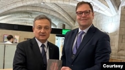 World Uyghur Congress President Dolkun Isa, left, with Dean Baxendale of Optimum Publishing International, at a March 14, 2024, event marking the publication of his book, The China Freedom Trap. (Photo courtesy Optimum Publishing International)