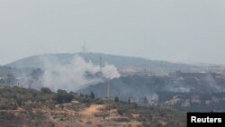 İsrailin Livanın cənubundakı Dharya kəndinə zərbələrindən sonra yaranmış tüstü.