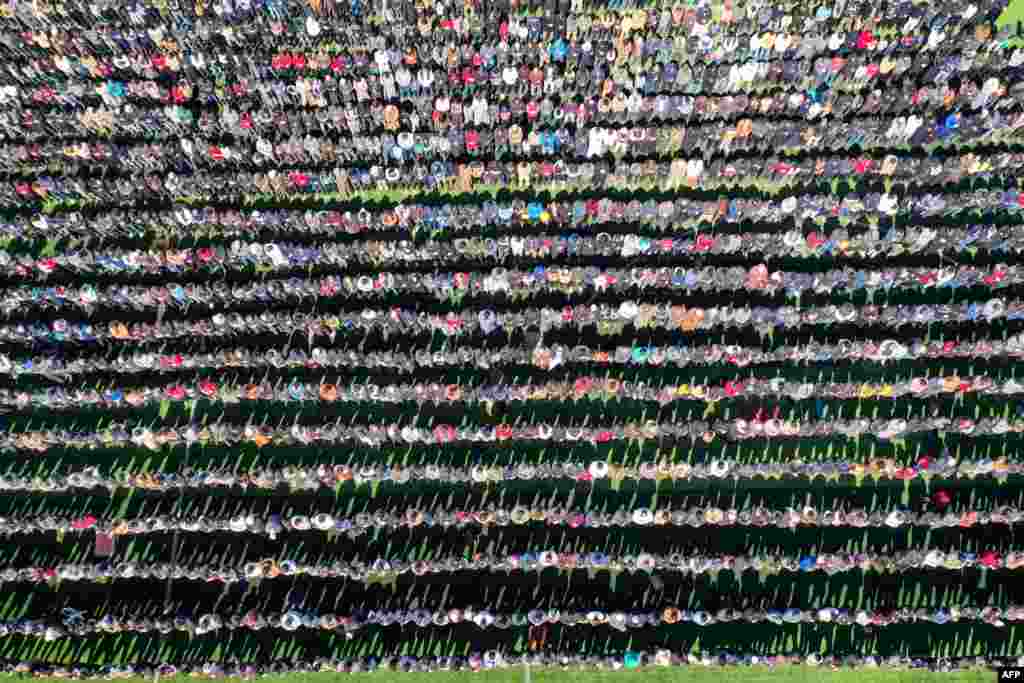 In this aerial view, Muslims perform the "rain prayer" inside a stadium in the Syrian rebel-held northwestern city of Idlib, Syria.