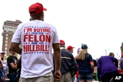 Supporters wait in line for a campaign rally with Republican presidential candidate former President Donald Trump in Asheville, N.C., Aug. 14, 2024.