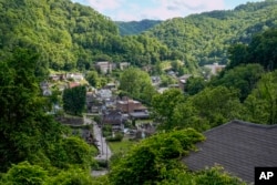 FILE - An overview of the city is seen on Wednesday, May 31, 2023, in Welch, West Virginia. (AP Photo/Chris Carlson)