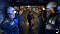 Miners head down for work at the pit-face at a coal mine in Dnipropetrovsk region, Ukraine, April 7, 2023.