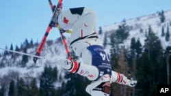 FILE - Canada's Chloe Dufour-Lapointe competes in a World Cup freestyle moguls competition at Deer Valley Resort in Park City, Utah, on Jan. 14, 2022.