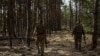 Ukrainian servicemen of the 93rd Separate Mechanized Brigade 'Kholodnyi Yar' look into the sky for Russian drones at a position near a frontline, amid Russia's attack on Ukraine, in Donetsk region, Ukraine, March 31, 2024. 