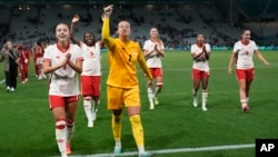 The Canadian team celebrates a 2-1 victory against France during the 2024 Summer Olympics in Saint-Etienne, France, on July 28, 2024. A court on July 31 dismissed Canada's appeal of the six-point deduction it received after two of its coaches spied on another team with drones.