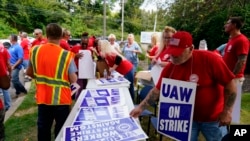 United Auto Workers members and supporters picket outside a General Motors facility in Langhorne, Pa., Sept. 22, 2023.