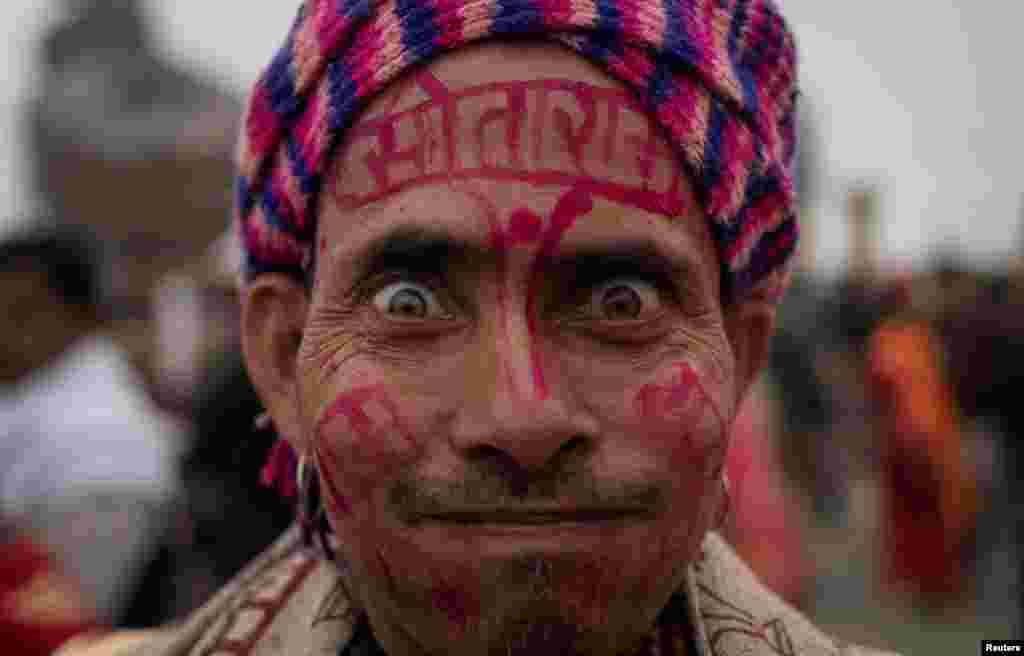 A Hindu devotee reacts as he arrives ahead of the opening of the grand temple of Lord Ram in Ayodhya in India.