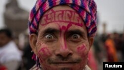 A Hindu devotee reacts as he arrives ahead of the opening of the grand temple of Lord Ram in Ayodhya in India.