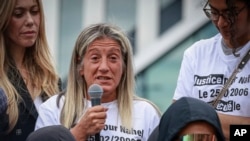 Mounia, mother of 17-year-old Nahel Merzouk who was killed by police, speaks at a protest to mark one year since his death, in Nanterre, west of Paris, June 29, 2024.