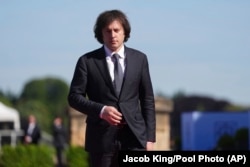 FILE - Georgian Prime Minister Irakli Kobakhidze is photographed in Woodstock, Oxfordshire, England, July 18, 2024. In May, he found himself at the center of controversy when he attended the funeral of Iranian President Ebrahim Raisi. (Jacob King/Pool Photo via AP)