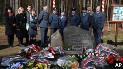 British soldiers pay tribute to Allied prisoners of war who dug tunnels out of German camps during World War II in Zagan, Poland, March 24, 2024, in a clever act of defiance during the 