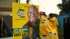 African National Congress (ANC) polling agents set up a tent decorated with party paraphernalia outside a polling station in Umlazi on May 29, 2024, during South Africas general election. 