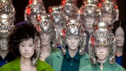 Models present creations by Chinese fashion studio D. Martina Queen during a show at China Fashion Week in Beijing, March 26, 2023.