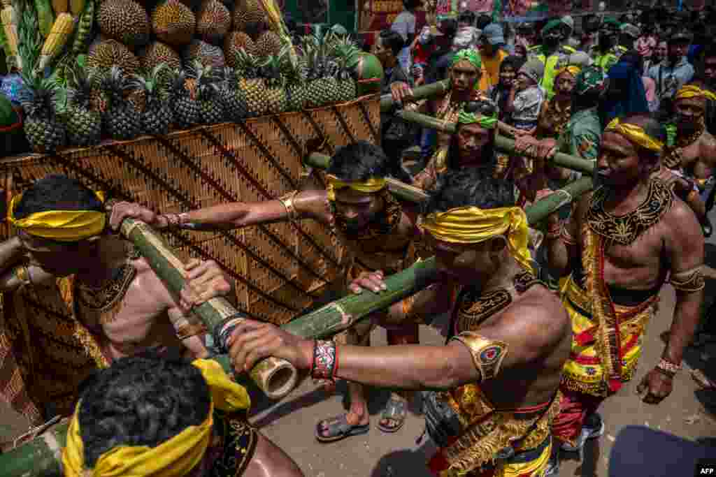 Participants parade with heaps of durians during the &#39;Kenduren&#39; festival in Jombang, East Java, Indonesia.