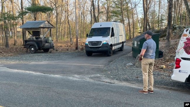 Federal officials leave the property where Jack Teixeira, a Massachusetts Air National Guard member, was taken into custody in Dighton, Mass., Thursday, April 13, 2023. (AP Photo/Jennifer McDermott)