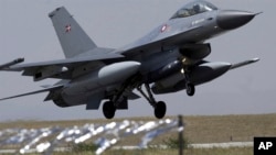 FILE - A Norwegian air force F-16 fighter lands at a Turkish air base in the Central Anatolian Turkish city of Konya on Sept. 8, 2004.