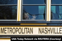 A child weeps while on the bus leaving The Covenant School, following a mass shooting at the school in Nashville, Tennessee, U.S. March 27, 2023. (Nicole Hester/USA Today Network via REUTERS)