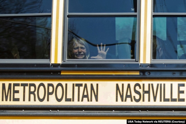 A child weeps while on the bus leaving The Covenant School, following a mass shooting at the school in Nashville, Tennessee, U.S. March 27, 2023. (Nicole Hester/USA Today Network via REUTERS)