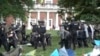 Police take down tents and detain protesters at the University of Virginia on May 4, 2024, in Charlottesville, Va. 