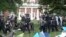 Police take down tents and detain protesters at the University of Virginia on May 4, 2024, in Charlottesville, Va. 
