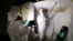 FILE - A crew works on asbestos abatement in Howell, Mich., Oct. 18, 2017. The Environmental Protection Agency on March 18, 2024, announced a ban on asbestos, a carcinogen that is still used in some chlorine bleach, brake pads and other products.
