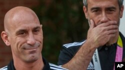 Luis Rubiales, left, president of Spain's soccer federation, stands next to Spain Head Coach Jorge Vilda after their World Cup victory at La Moncloa Palace in Madrid, Aug. 22, 2023.