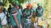 FILE - Mariama Sonko and other members of the We Are the Solution movement take part in a lemon balm workshop in the Casamance village of Niaguis, Senegal, March 7, 2024. 