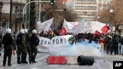 Riot police try to control demonstrators during protests in Athens, Greece, March 5, 2023.