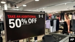 A sale sign is displayed at a retail store in Rosemont, Illinois, June 25, 2024.