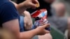 A spectator snacks at a baseball game in Baltimore, Maryland, April 26, 2023, in Baltimore.