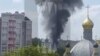 Smoke rises on the site of a helicopter crash in the town of Klintsy in the Bryansk Region, Russia, in this still image taken from video released May 13, 2023. (Ostorozhno Novosti/Handout via Reuters)