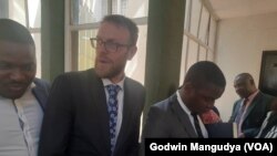 Doug Coltart and Tapiwa Muchineripi in court
