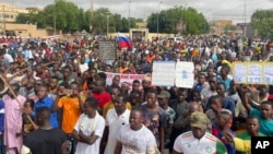 FILE - Supporters of Niger's ruling junta gather for a protest called to fight for the country's freedom and push back against foreign interference, in Niamey, Niger, Aug. 3, 2023.