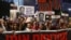 Relatives of Israeli hostages taken captive on October 7 by Palestinian militants in Gaza hold portraits of those taken during a demonstration in Tel Aviv, Israel, calling for their release, May 4, 2024.