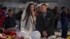 A couple stand at a makeshift memorial in front of the Crocus City Hall on the western outskirts of Moscow, March 27, 2024. The March 22 massacre at the venue was the deadliest extremist attack on Russian soil in nearly two decades.