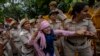 Police detain members of India's opposition Congress party during a protest against the Narendra Modi-led government in New Delhi, India, Aug. 8, 2023.