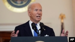 President Joe Biden speaks in the Cross Hall of the White House, July 1, 2024, in Washington.