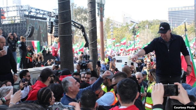 Exiled Iranian Crown Prince Reza Pahlavi greets supporters at a rally in downtown Los Angeles, Feb. 11, 2023, held in solidarity with protests in Iran against the nation's Islamist rulers. (Karmel Melamed)