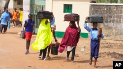 Students leave for vacation following the closures of schools by government before the elections in Yola, Nigeria, Feb. 23, 2023.