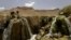 FILE - An Afghan man performs ablution before prayers at Band-E-amir in Bamiyan, Afghanistan, Aug. 31, 2005. Unknown gunmen killed four people May 17, 2024, in Bamiyan's central market, Taliban authorities said.
