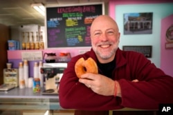 Owner Sean Young poses at Leavitt's Country Bakery, Thursday, April 13, 2023. (AP Photo/Robert F. Bukaty)