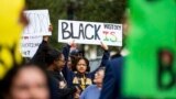 FILE - Hundreds participate in the National Action Network demonstration in response to Gov. Ron DeSantis' rejection of a high school African American history course, Wednesday, Feb. 15, 2023. (Alicia Devine/Tallahassee Democrat via AP, File)
