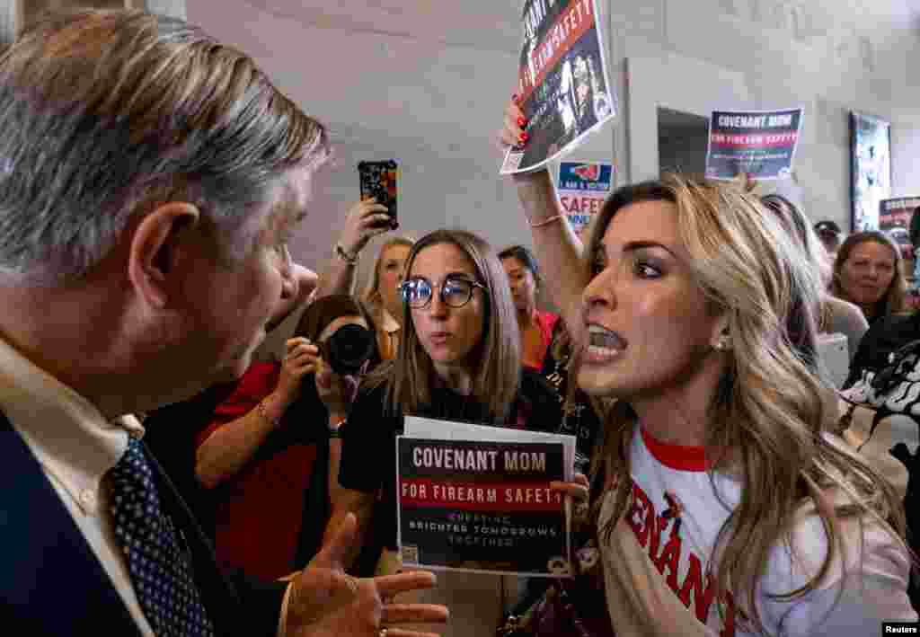 A man argues with Mary Joyce, a Covenant School mother, after the Tennessee House Republicans called for a vote to end special session on public safety to discuss gun violence in the wake of the Covenant School shooting in Nashville, Tennessee, Aug. 29, 2023.&nbsp;