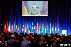 Ukrainian President Volodymyr Zelenskyy speaks via video conference speaks at the NATO Parliamentary Assembly in Copenhagen, Denmark, Oct. 9, 2023. (Ritzau Scanpix/Liselotte Sabroe/via Reuters)