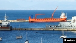FILE - Russian-flagged cargo ship Lady R docks at Simon's Town naval base, in Cape Town, South Africa, Dec. 7, 2022. 